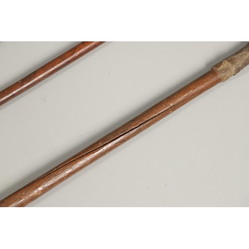 201 - THREE AFRICAN THROWING SPEARS. An African spear with a leaf shaped point on square shaft and wooden ... 