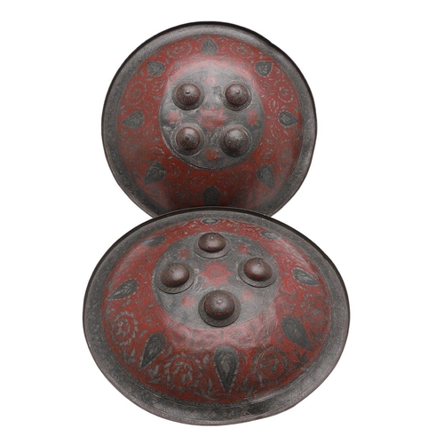 203 - A PAIR OF DECORATED INDIAN CIRCULAR SHIELDS. A pair of 19th century Indian Benares type circular shi... 