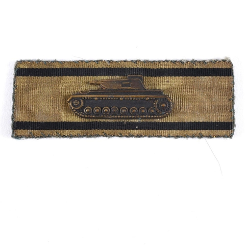 217 - A SECOND WORLD WAR GERMAN TANK DESTROYERS BADGE IN GOLD. A Tank Destroyers badge with black stripes ... 