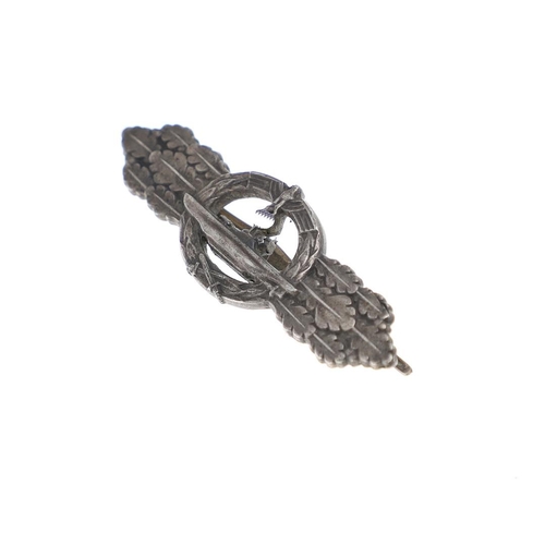 227 - A SECOND WORLD WAR GERMAN KRIEGSMARINE U-BOAT CLASP IN SILVER. A U Boat clasp with eagle with Swasti... 