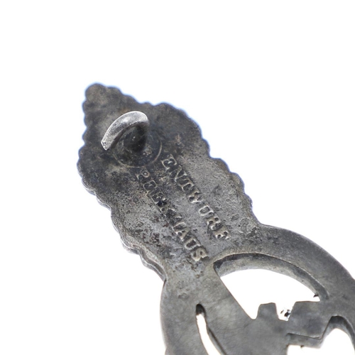 227 - A SECOND WORLD WAR GERMAN KRIEGSMARINE U-BOAT CLASP IN SILVER. A U Boat clasp with eagle with Swasti... 