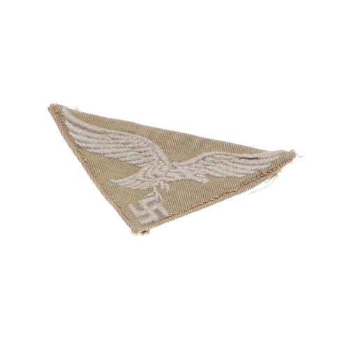 235 - A SECOND WORLD WAR LUFTWAFFE AFRIKAKORPS BREAST EAGLE. A Luftwaffe Afrikakorps machine woven breast ... 