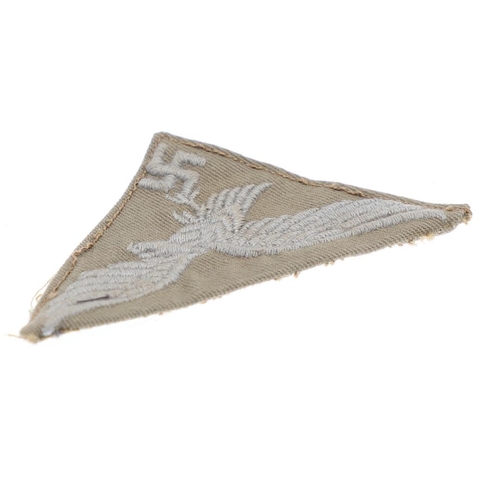 235 - A SECOND WORLD WAR LUFTWAFFE AFRIKAKORPS BREAST EAGLE. A Luftwaffe Afrikakorps machine woven breast ... 