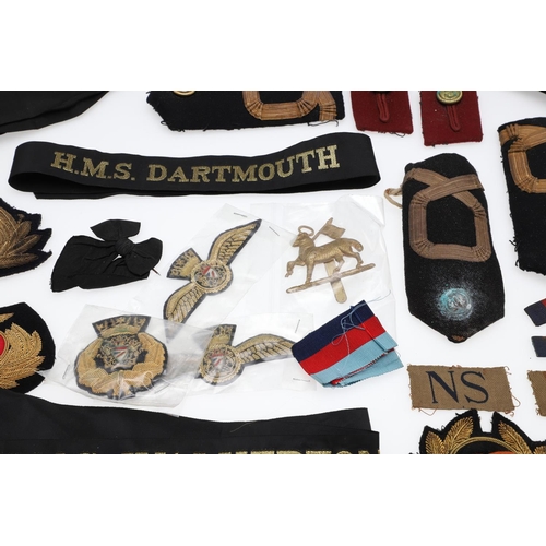 237 - A SCOTTISH CLAN BADGE AND A COLLECTION OF NAVY AND OTHER INSIGNIA. A gilt metal Scottish clan brooch... 