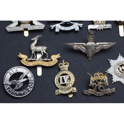 238 - A LARGE COLLECTION OF MILITARY CAP BADGES AND BUTTONS. A collection of modern military cap badges to... 