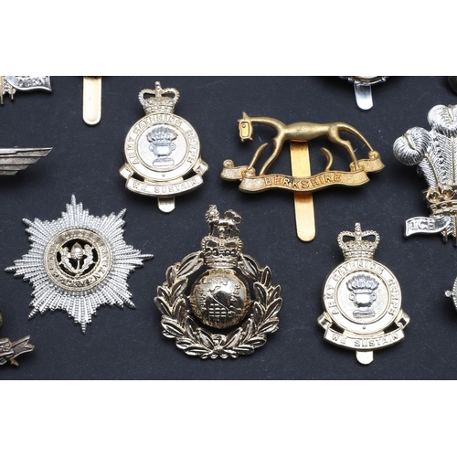 238 - A LARGE COLLECTION OF MILITARY CAP BADGES AND BUTTONS. A collection of modern military cap badges to... 