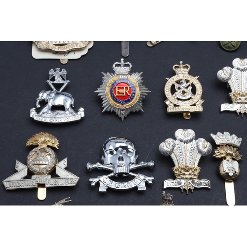 238 - A LARGE COLLECTION OF MILITARY CAP BADGES AND BUTTONS. A collection of modern military cap badges to... 