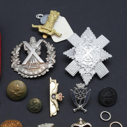 238 - A LARGE COLLECTION OF MILITARY CAP BADGES AND BUTTONS. A collection of modern military cap badges to... 