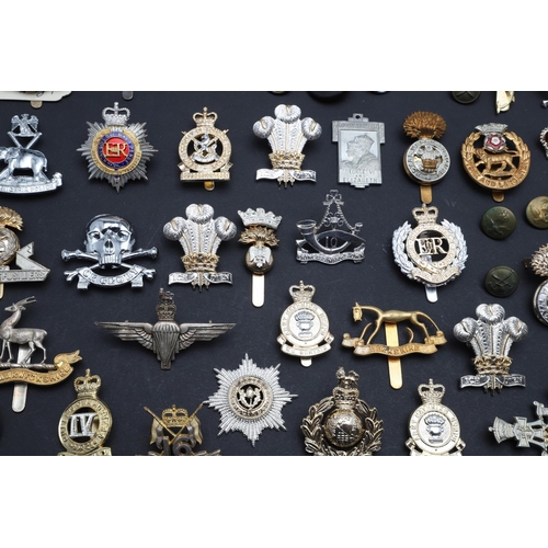 238 - A LARGE COLLECTION OF MILITARY CAP BADGES AND BUTTONS. A collection of modern military cap badges to... 