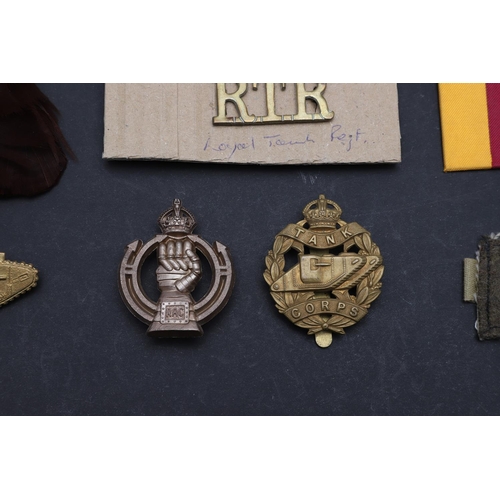 249 - A COLLECTION OF TANK CORPS/REGIMENT BADGES. A First World War 1917 type N.C.O.s' Tank Corps Arm badg... 