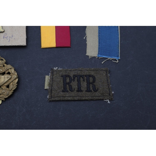 249 - A COLLECTION OF TANK CORPS/REGIMENT BADGES. A First World War 1917 type N.C.O.s' Tank Corps Arm badg... 