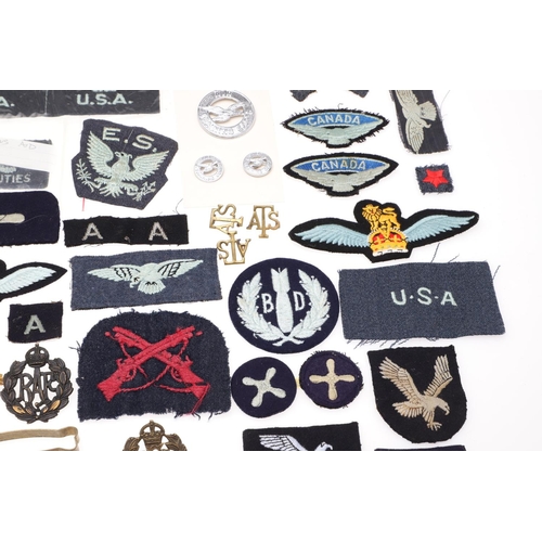 261 - A COLLECTION OF ROYAL FLYING CORPS AND RAF CAP BADGES, PATCHES AND SIMILAR ITEMS. Two Royal Flying C... 