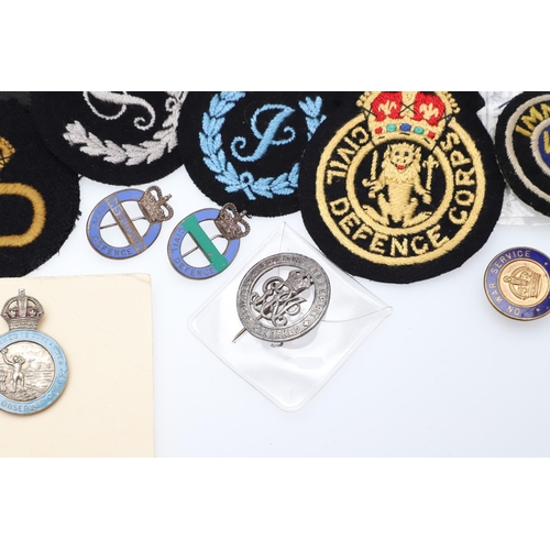 262 - A COLLECTION OF CIVIL DEFENCE CORPS ARM BANDS, BADGES AND OTHER SIMILAR ITEMS. A collection of Civil... 