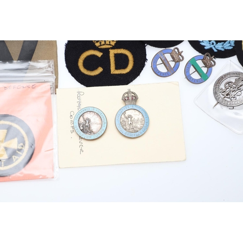 262 - A COLLECTION OF CIVIL DEFENCE CORPS ARM BANDS, BADGES AND OTHER SIMILAR ITEMS. A collection of Civil... 