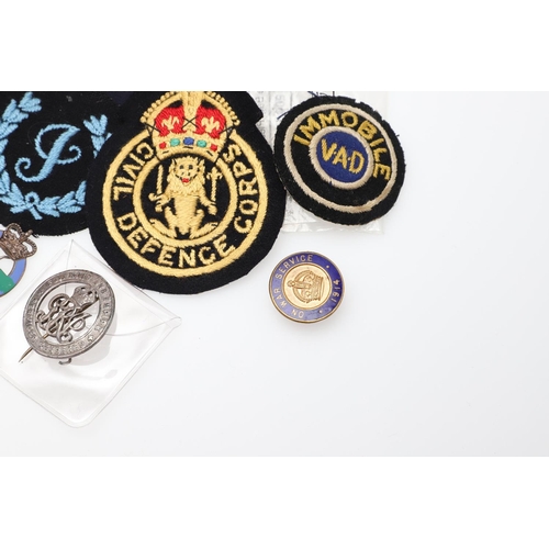 262 - A COLLECTION OF CIVIL DEFENCE CORPS ARM BANDS, BADGES AND OTHER SIMILAR ITEMS. A collection of Civil... 