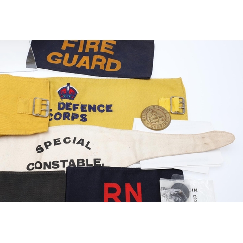 262 - A COLLECTION OF CIVIL DEFENCE CORPS ARM BANDS, BADGES AND OTHER SIMILAR ITEMS. A collection of Civil... 