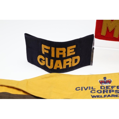 262 - A COLLECTION OF CIVIL DEFENCE CORPS ARM BANDS, BADGES AND OTHER SIMILAR ITEMS. A collection of Civil... 