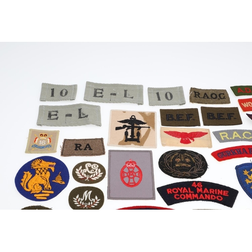 264 - A LARGE COLLECTION OF MILITARY UNIFORM CLOTH PATCHES, SHOULDER TITLES, TRADE PATCHES AND OTHERS. A l... 