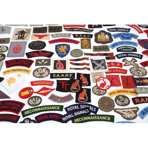 264 - A LARGE COLLECTION OF MILITARY UNIFORM CLOTH PATCHES, SHOULDER TITLES, TRADE PATCHES AND OTHERS. A l... 