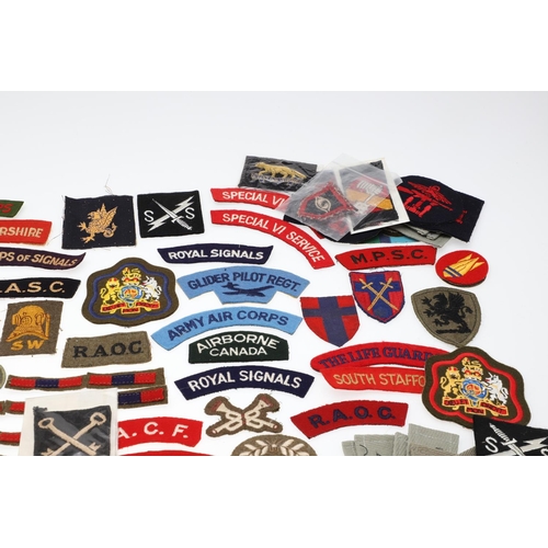 264 - A LARGE COLLECTION OF MILITARY UNIFORM CLOTH PATCHES, SHOULDER TITLES, TRADE PATCHES AND OTHERS. A l... 