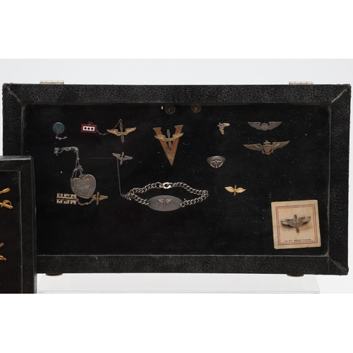 265 - A COLLECTION OF AMERICAN HAT INSIGNIA AND OTHER BADGES AND PATCHES. A mounted collection of crossed ... 