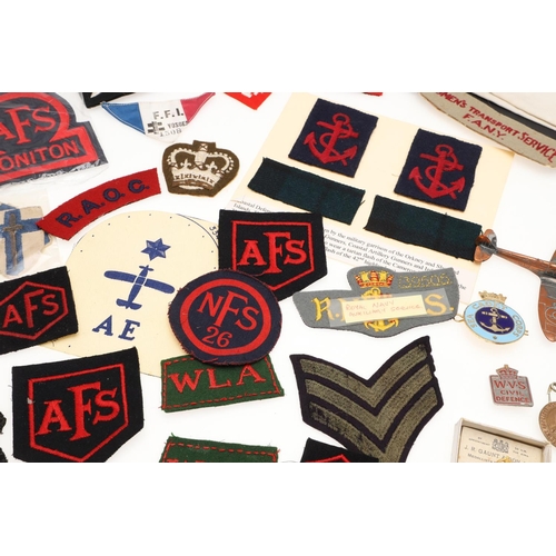 268 - A COLLECTION OF SECOND WORLD WAR PATCHES AND BADGES TO INCLUDE WOMEN's  TRANSPORT SERVICE AND HONITO... 