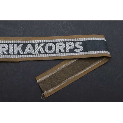 269 - A SECOND WORLD WAR GERMAN 'AFRIKAKORPS' CUFFBAND. A Second World War German machine woven 'Afrikakor... 