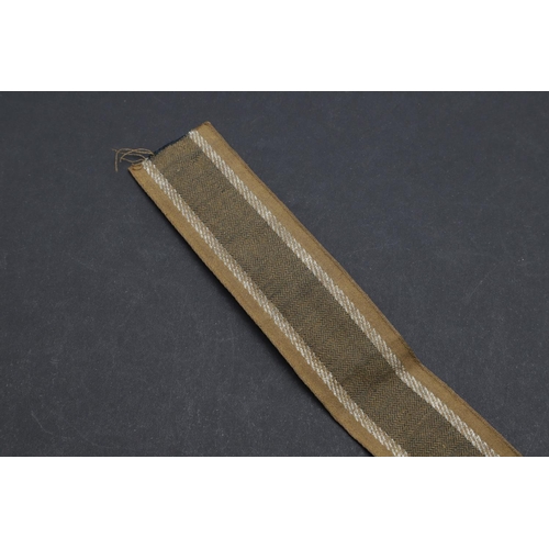 269 - A SECOND WORLD WAR GERMAN 'AFRIKAKORPS' CUFFBAND. A Second World War German machine woven 'Afrikakor... 