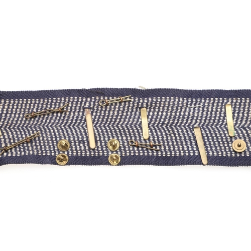 271 - A BELT OF SECOND WORLD WAR CAP BADGES WITH LINKS TO THE SPECIAL OPERATIONS EXECUTIVE. A collection o... 