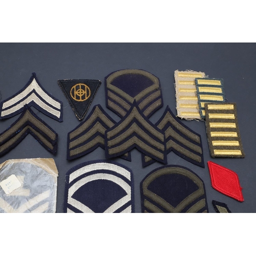 277 - A COLLECTION OF SECOND WORLD WAR AND LATER AMERICAN FABRIC UNIT PATCHES AND RANK PATCHES. Patches fo... 