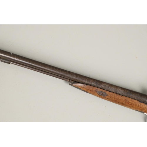 28 - A MID 19TH CENTURY PERCUSSION FIRING SPORTING GUN. A double barreled shotgun with 75
cm Damascus bar... 
