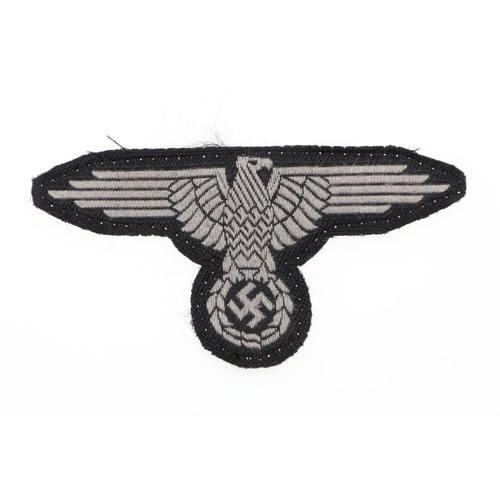 289 - A WAFFEN-SS MAN's  BEVO TYPE ARM-EAGLE. A Man's  Bevo type arm-eagle machine woven in grey silk type... 