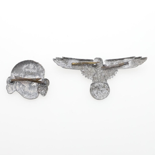 290 - A SET OF SECOND WORLD WAR GERMAN SS CAP INSIGNIA. A cap insignia set comprising zinc eagle and secon... 