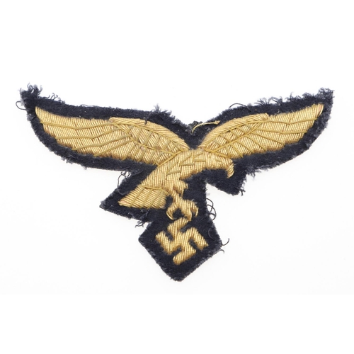 299 - A LUFTWAFFE GENERAL's  BREAST EAGLE. A gold bullion type breast eagle with a flying eagle with swast... 