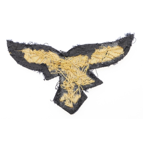 299 - A LUFTWAFFE GENERAL's  BREAST EAGLE. A gold bullion type breast eagle with a flying eagle with swast... 