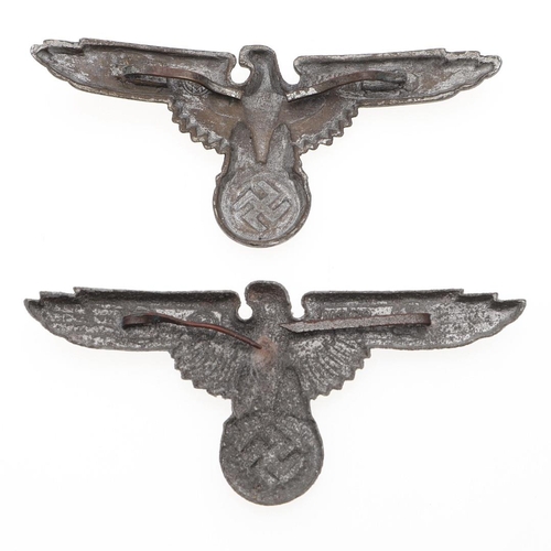 303 - TWO WAFFEN SS PEAKED CAP EAGLES. Two late war type peaked cap eagles in zinc with brass pins, hollow... 