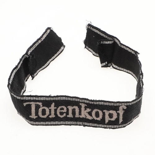 313 - A SECOND WORLD WAR GERMAN OTHER RANK's  'TOTENKOPF' CUFFBAND. A Waffen-SS Other Rank's  cuffband 'To... 