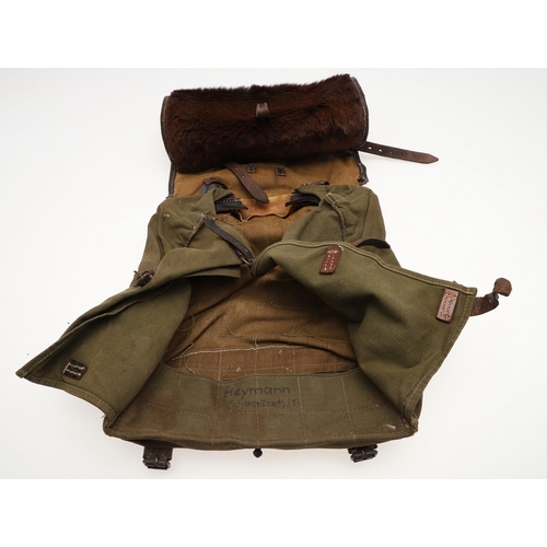 314 - A SECOND WORLD WAR GERMAN ARMY BACKPACK. A German army or Waffen-SS soldier's  backpack with fur cov... 