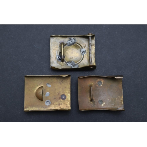 315 - THREE SIMILAR FIRST WORLD WAR GERMAN BELT BUCKLES. Two similar Prussian buckles with nickel centres ... 