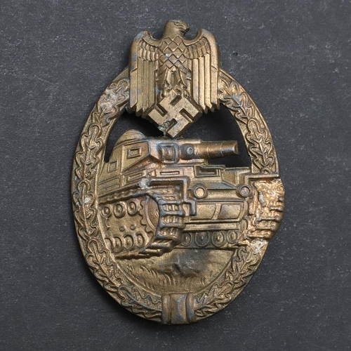 317 - A SECOND WORLD WAR GERMAN BRONZE PANZER ASSAULT BADGE. A bronze Panzer assault badge with a tank adv... 