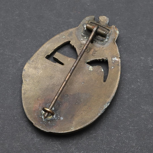 317 - A SECOND WORLD WAR GERMAN BRONZE PANZER ASSAULT BADGE. A bronze Panzer assault badge with a tank adv... 