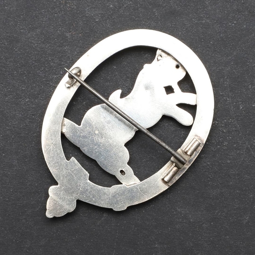 322 - A SCOTTISH CLAN SUTHERLAND BADGE. A silver coloured metal Clan Sutherland badge with a wild cat to t... 