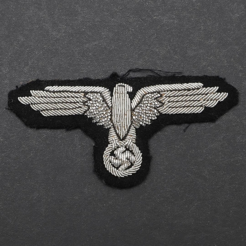 330 - A SECOND WORLD WAR GERMAN WAFFEN-SS OFFICER's  ARMEAGEL. An armeagle worked in silver bullion wire o... 