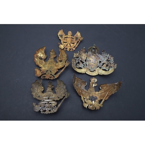 342 - A COLLECTION OF FIRST WORLD WAR GERMAN PICKELHAUBE HELMET PLATES. Five similar Imperial German helme... 