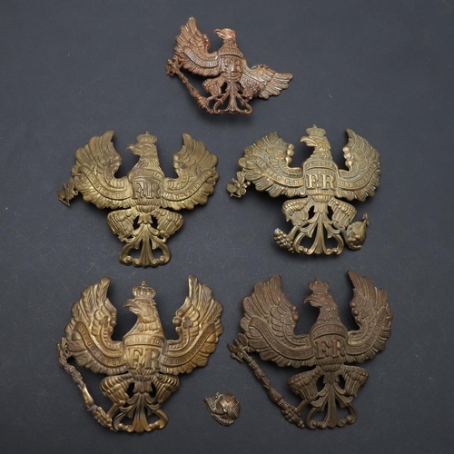 344 - A COLLECTION OF FIVE IMPERIAL GERMAN PICKELHAUBE HELMET PLATES. A collection of Pickelhaube helmet p... 