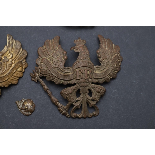 344 - A COLLECTION OF FIVE IMPERIAL GERMAN PICKELHAUBE HELMET PLATES. A collection of Pickelhaube helmet p... 