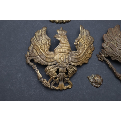 344 - A COLLECTION OF FIVE IMPERIAL GERMAN PICKELHAUBE HELMET PLATES. A collection of Pickelhaube helmet p... 