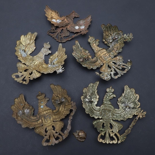 344 - A COLLECTION OF FIVE IMPERIAL GERMAN PICKELHAUBE HELMET PLATES. A collection of Pickelhaube helmet p... 