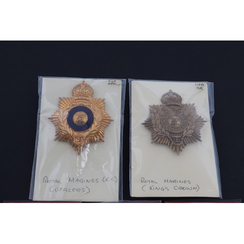 351 - A COLLECTION OF ROYAL MARINES CAP BADGES. A collection of five Royal Marines cap badges to include a... 