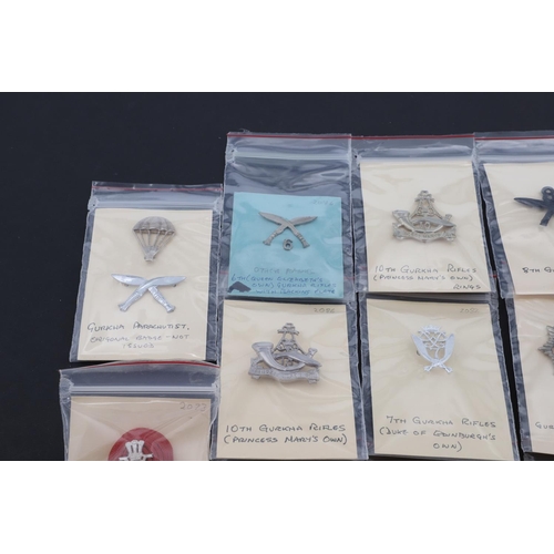 358 - A COLLECTION OF CAP BADGES FOR GURKHA REGIMENTS. A collection of cap and similar badges for the Gurk... 